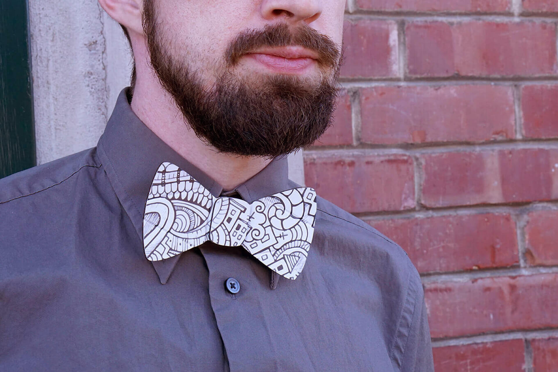 A lifestyle shot of the cardboard doodle bow tie.
