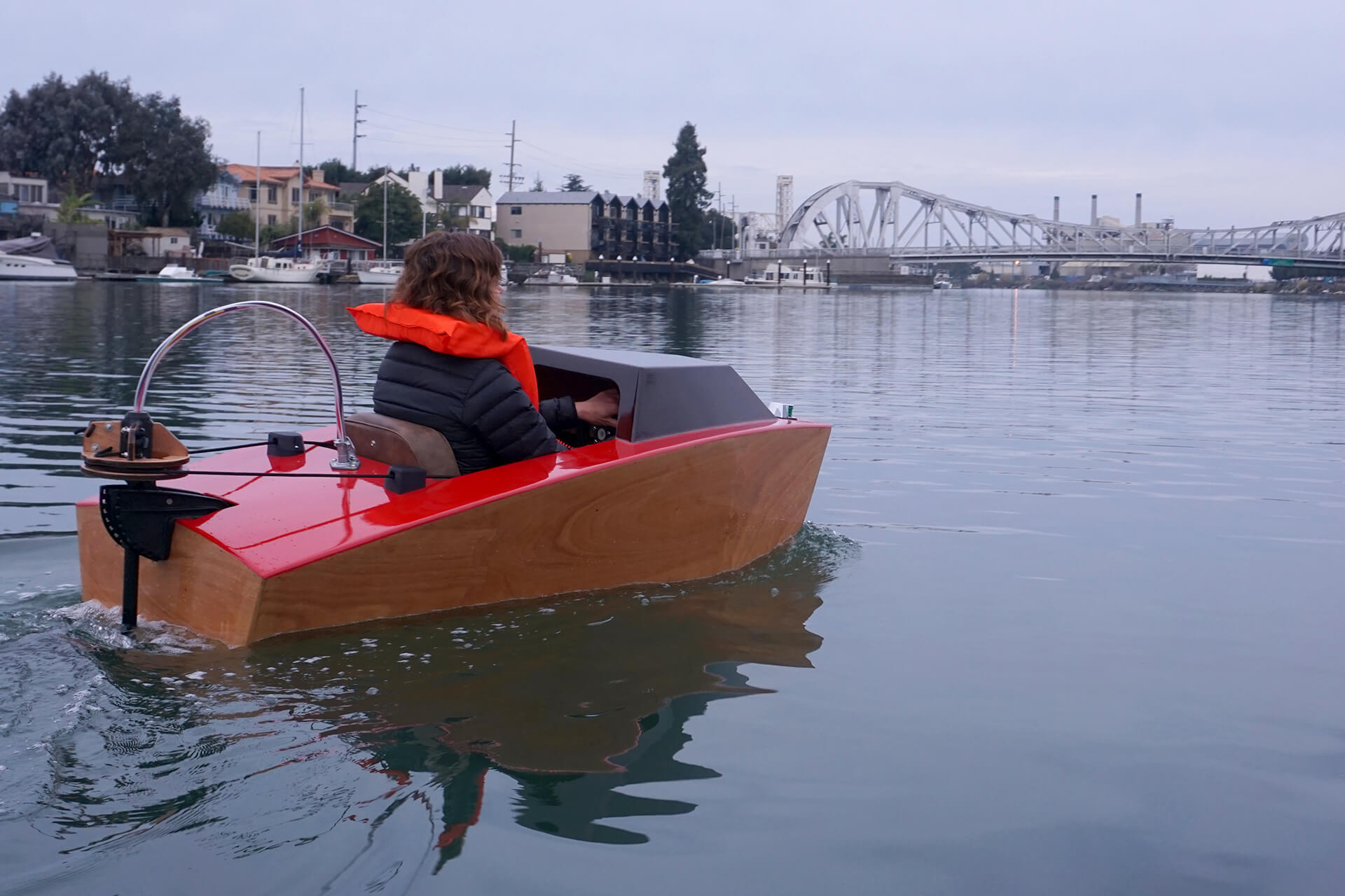Erika riding towards the bridge at the first launch of the mini electric boat.