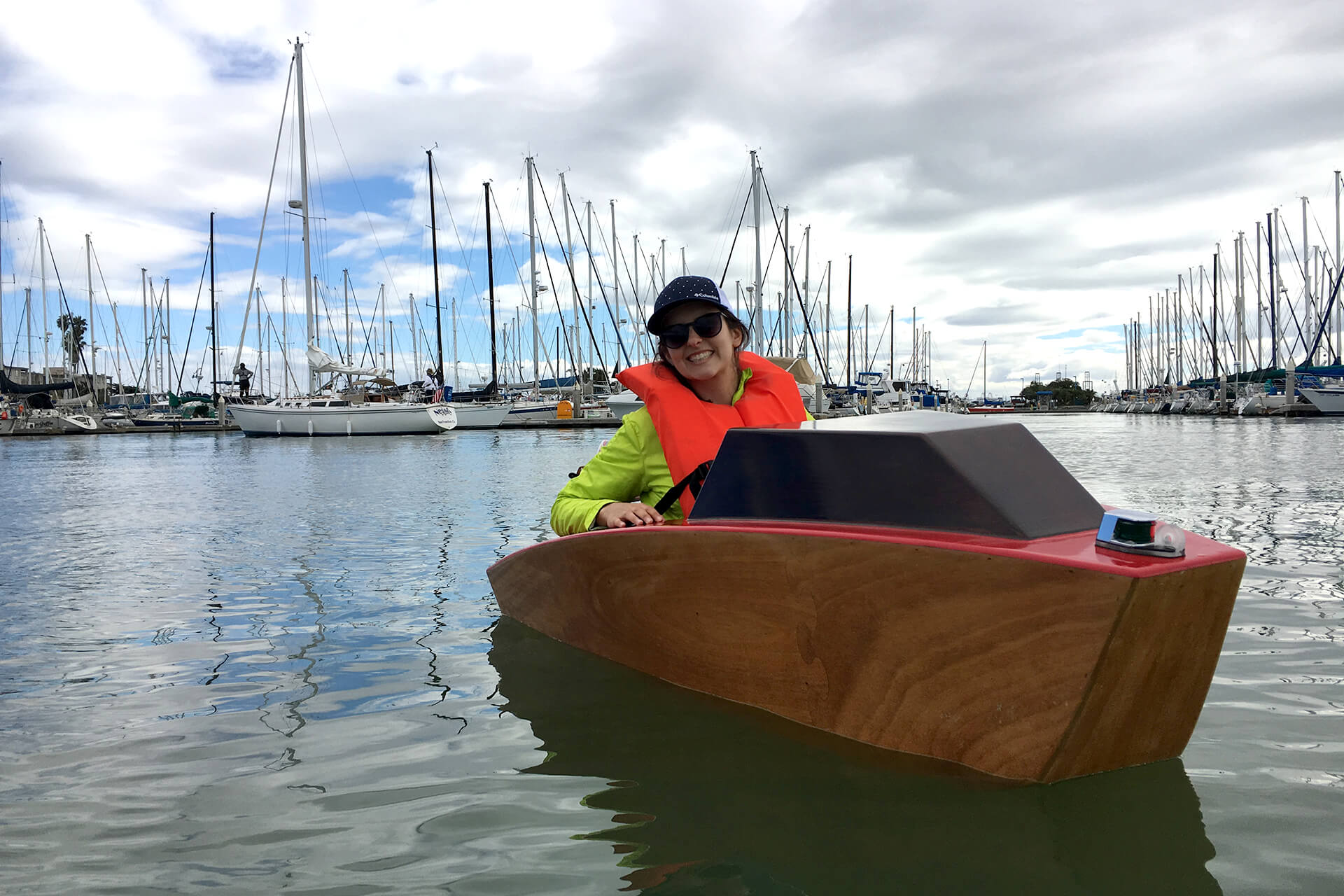 JuliAnn showing off the mini boat at the Emeryville harbor.