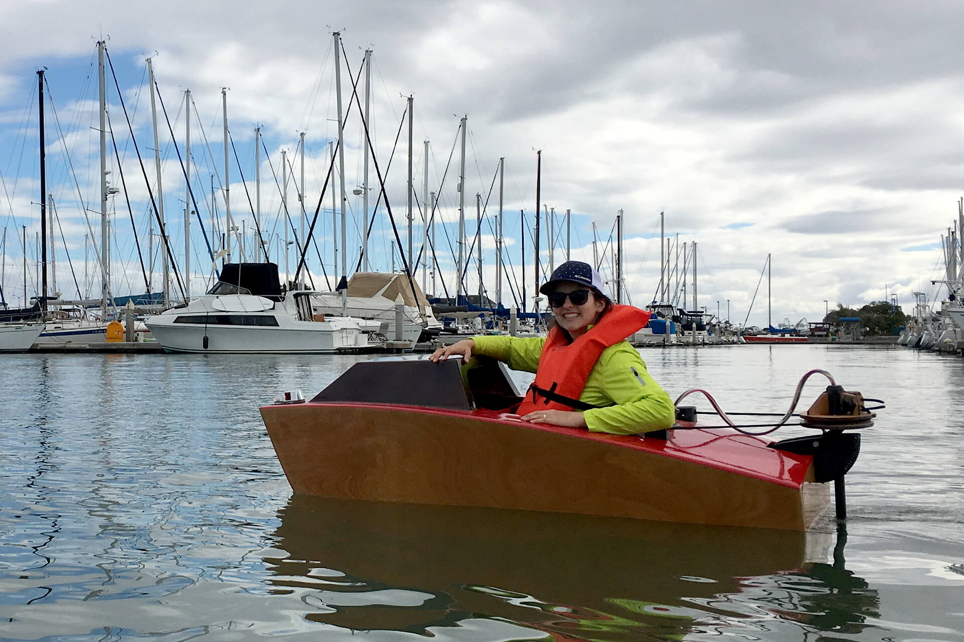 JuliAnn in a mini boat at the Emeryville harbor.