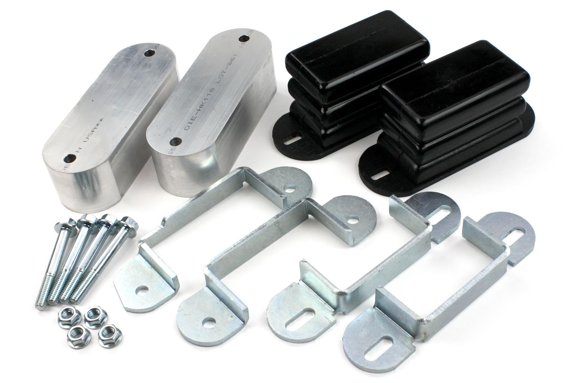 A lift kit for a vehicle involving blocks and suspension bumps.